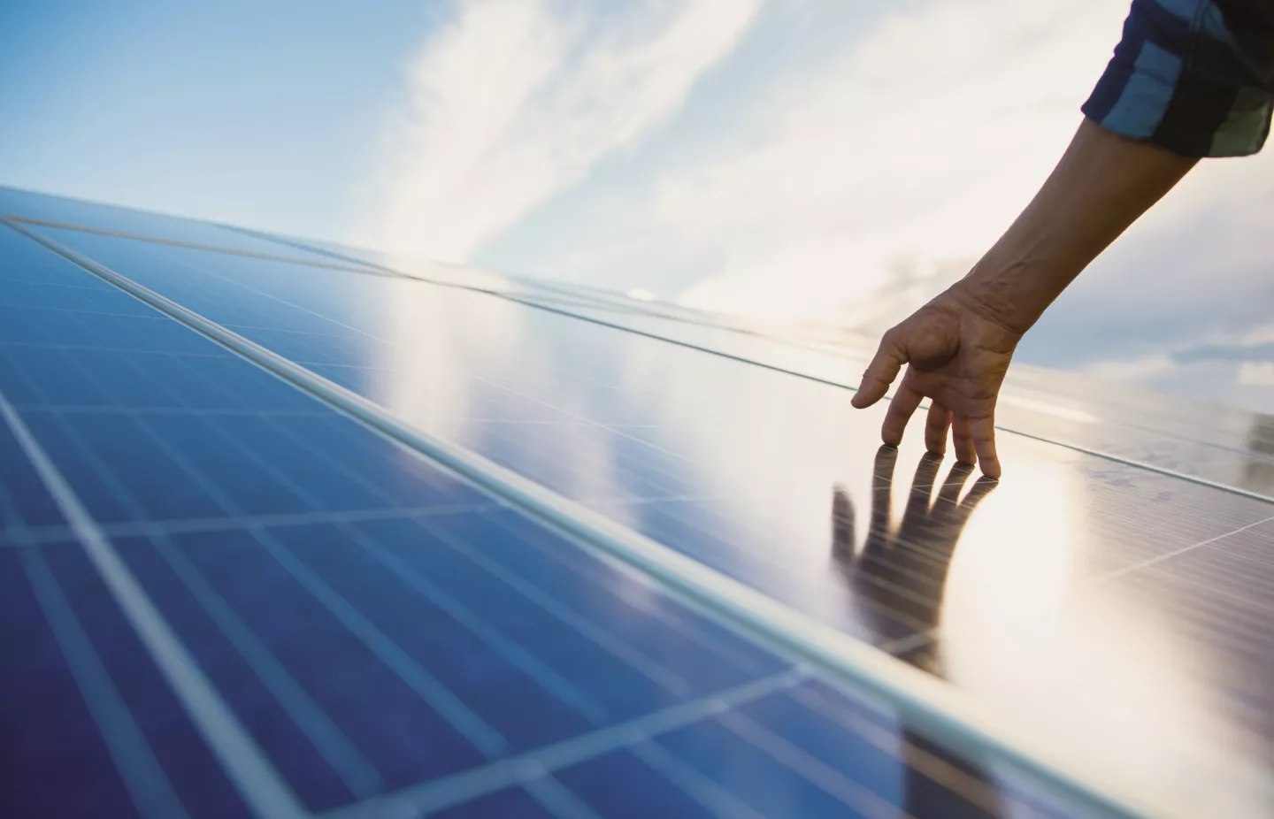 Person touches photovoltaic system